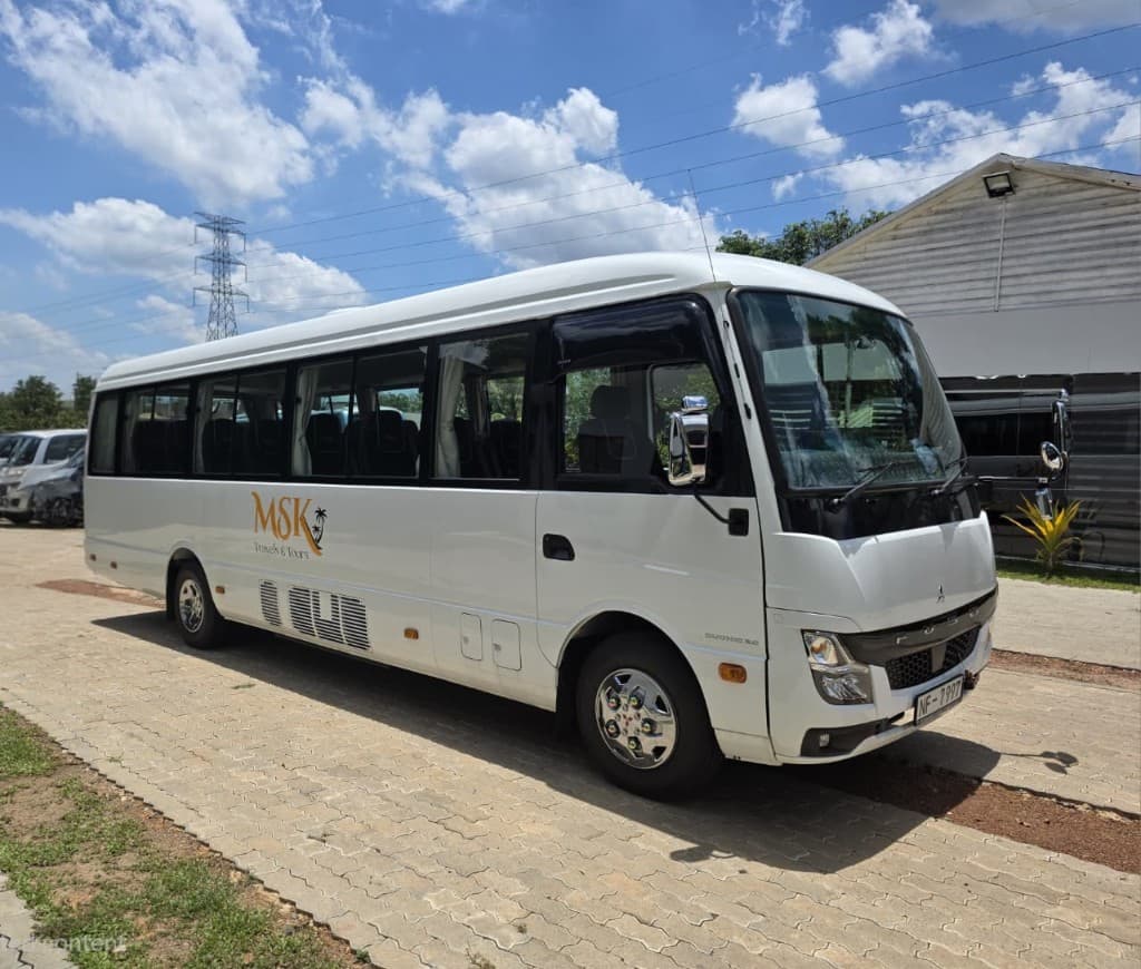 MSK Travels bus exterior with MSK branding — side front view
