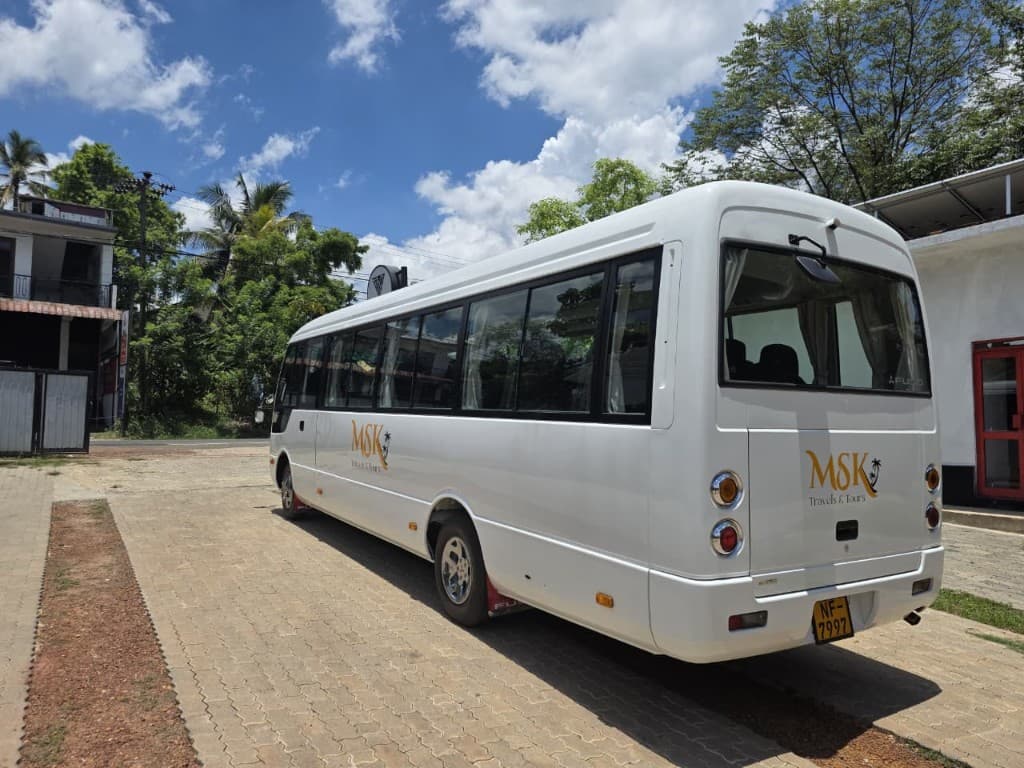 MSK Travels bus rear view with CCTV camera — NF-7997